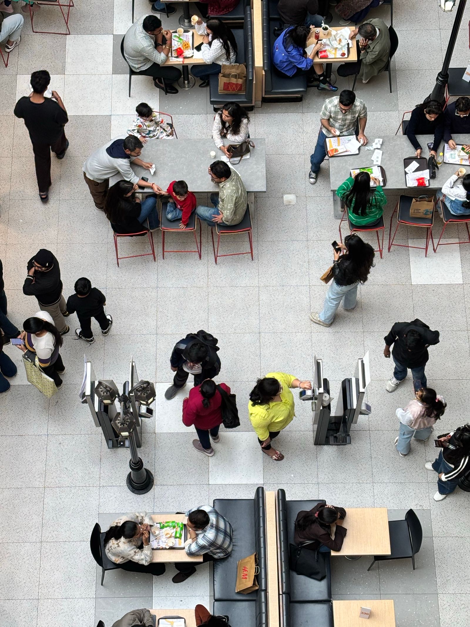 A busy mall food court seen from above