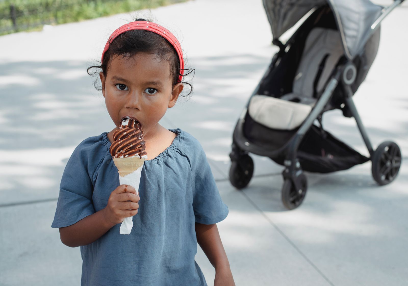 A little girl eating an ice-cream cone